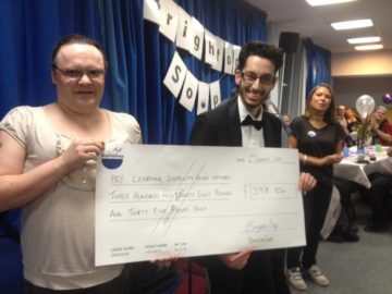 Rohan and Chloe with the winners cheque